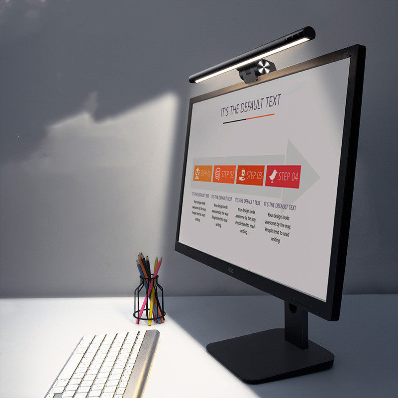 Smitech asymmetric screen light bar mounted on monitor casting warm glare free light across home office desk setup UK
