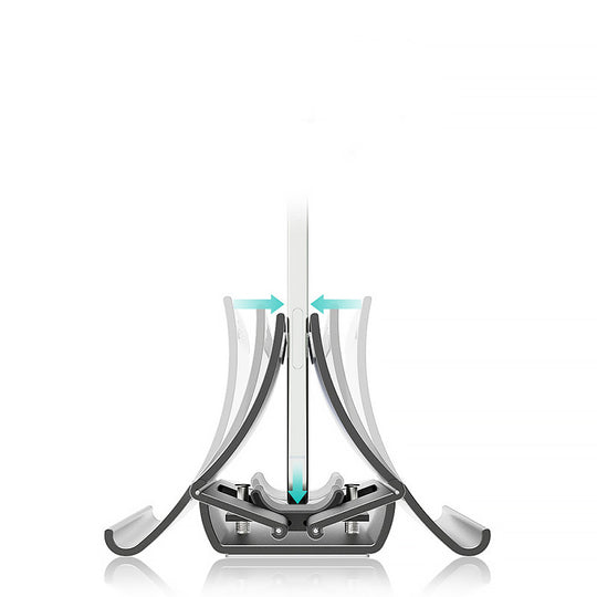 Aluminium gravity laptop stand holding MacBook on desk with keyboard and mouse setup